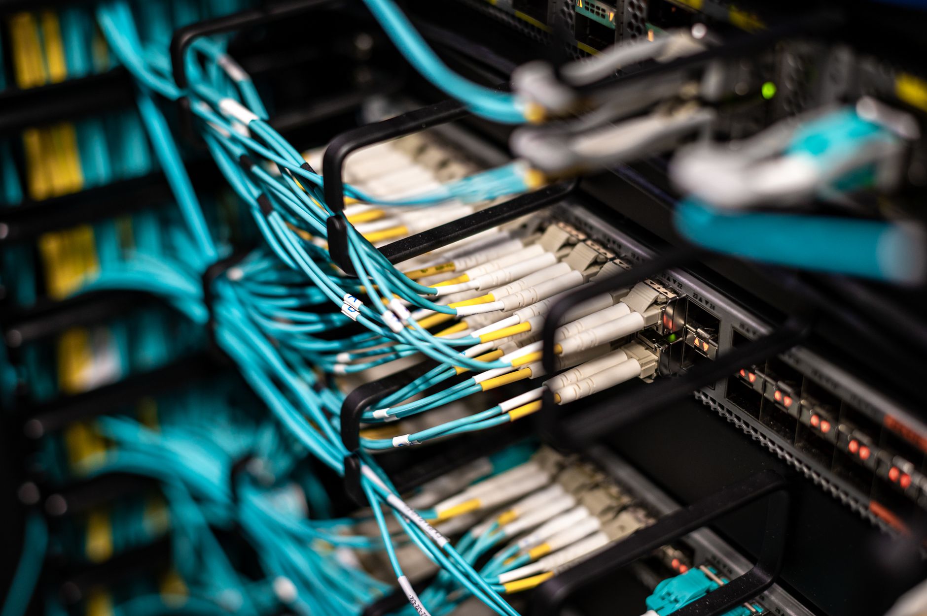 at&t fiber optic cable repair - Numerous wires and cables mounted into server patch panel in modern data center