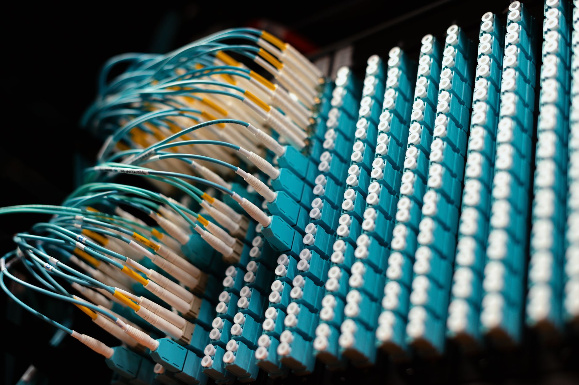 at&t fiber optic cable repair - From below of long thin identical blue cables connected to small round electrical connectors