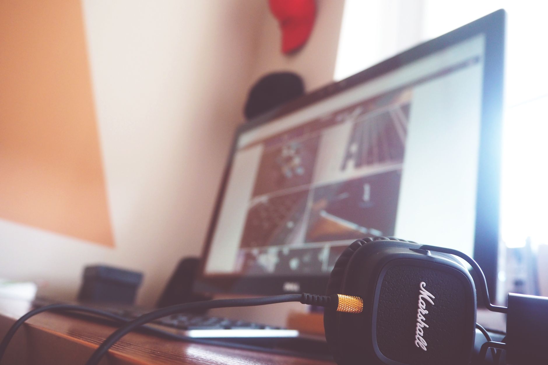 computer is connected but no internet - A contemporary desk setup featuring headphones and a computer screen displaying digital content.
