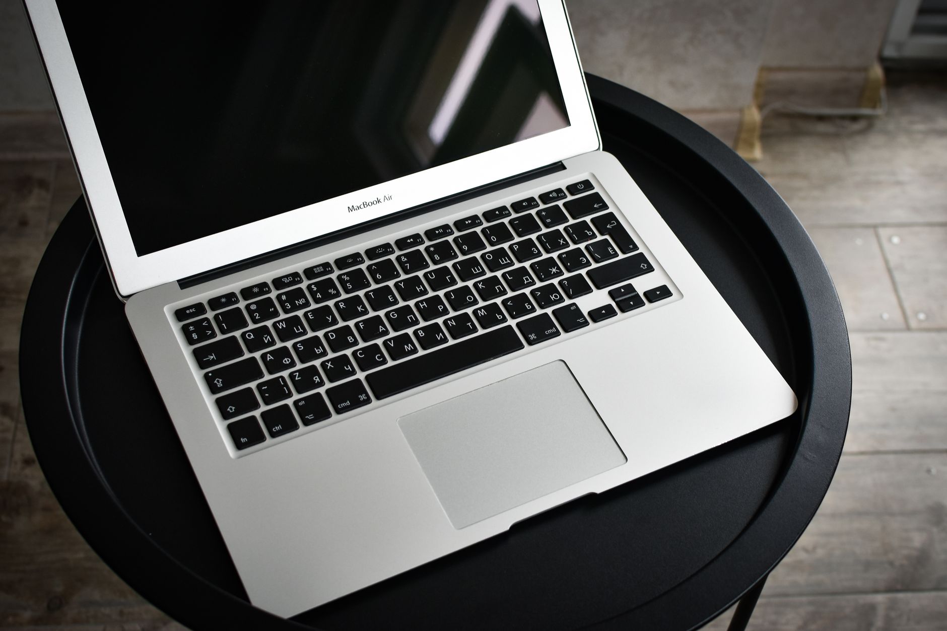 computer says connected but no internet - A stylish laptop sits elegantly on a black round table in an indoor setting, ideal for tech and workspace themes.