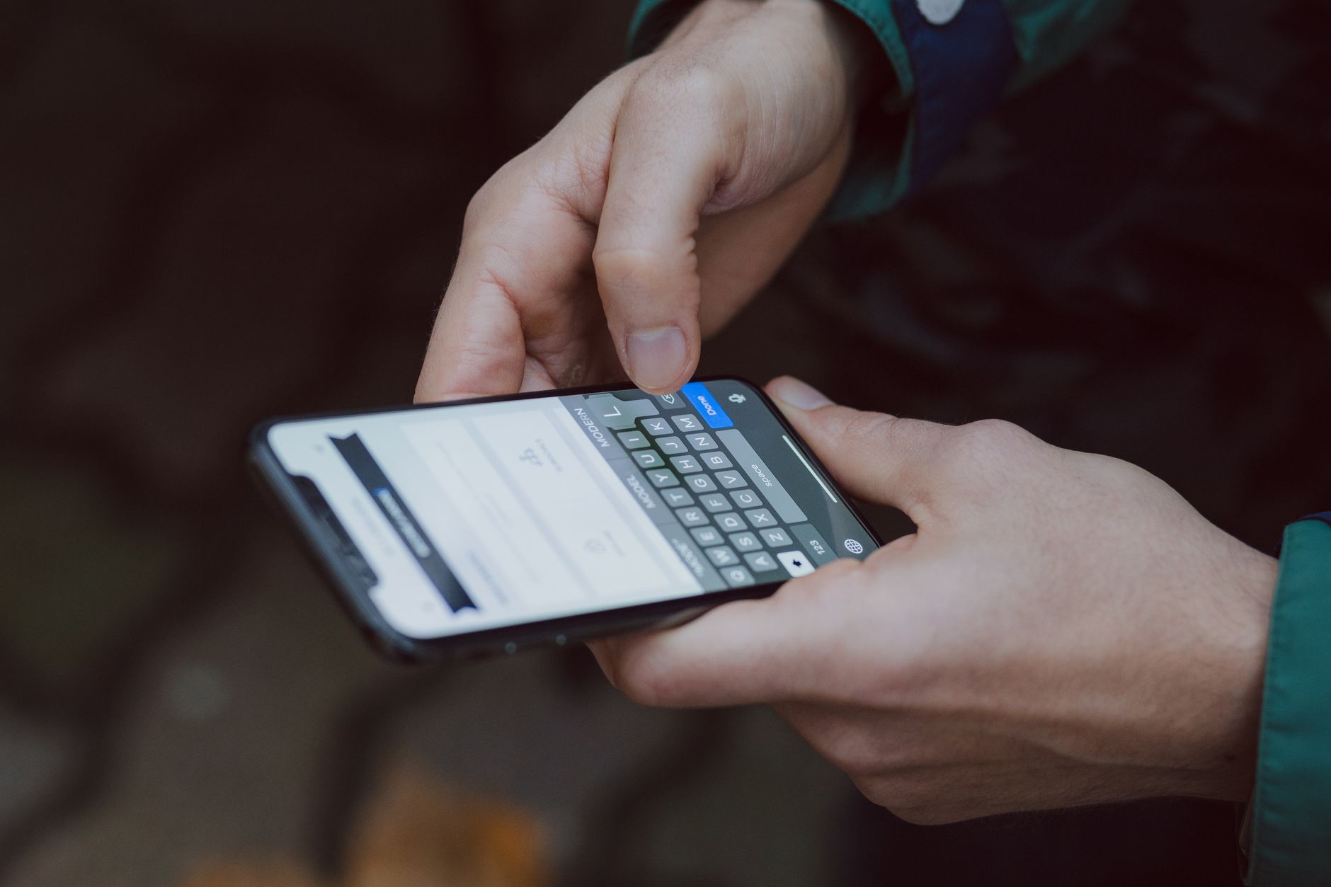 connected to internet but no wifi - Close-up of person texting on a smartphone. Outdoor setting with wireless connectivity.