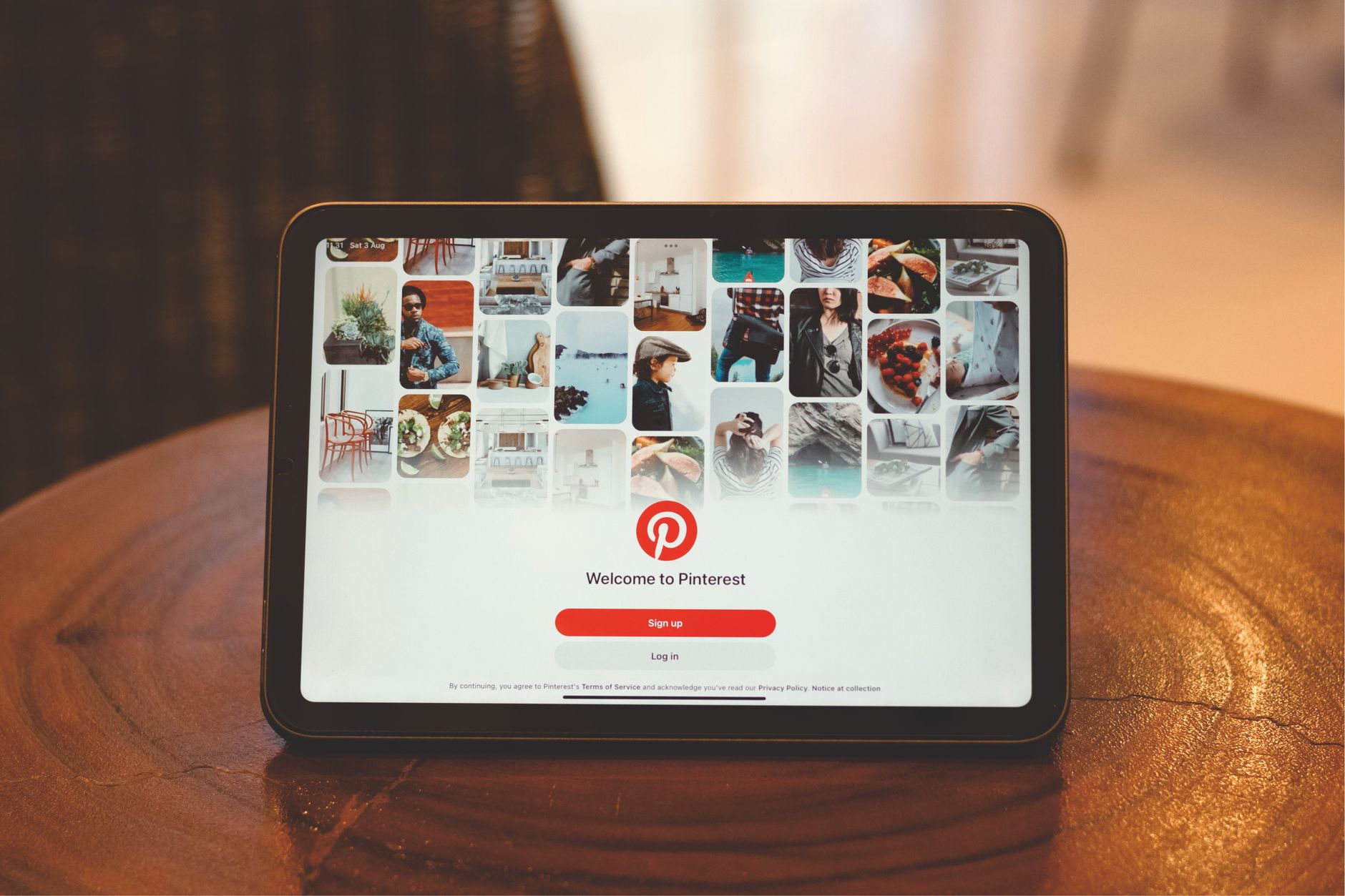 connected to wifi no internet access - Tablet showing Pinterest login screen on a wooden table indoors.