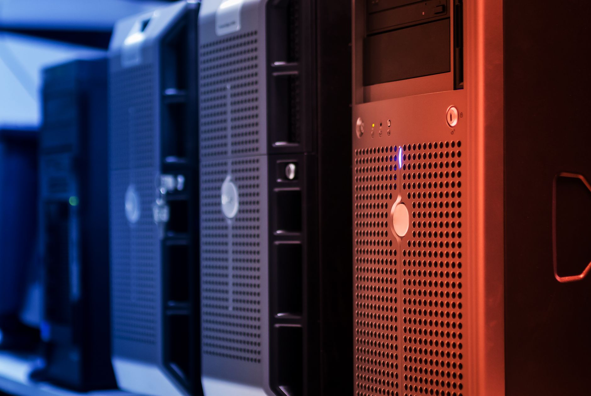 network reset win 10 - Close-up of tower servers in a data center with blue and red lighting.