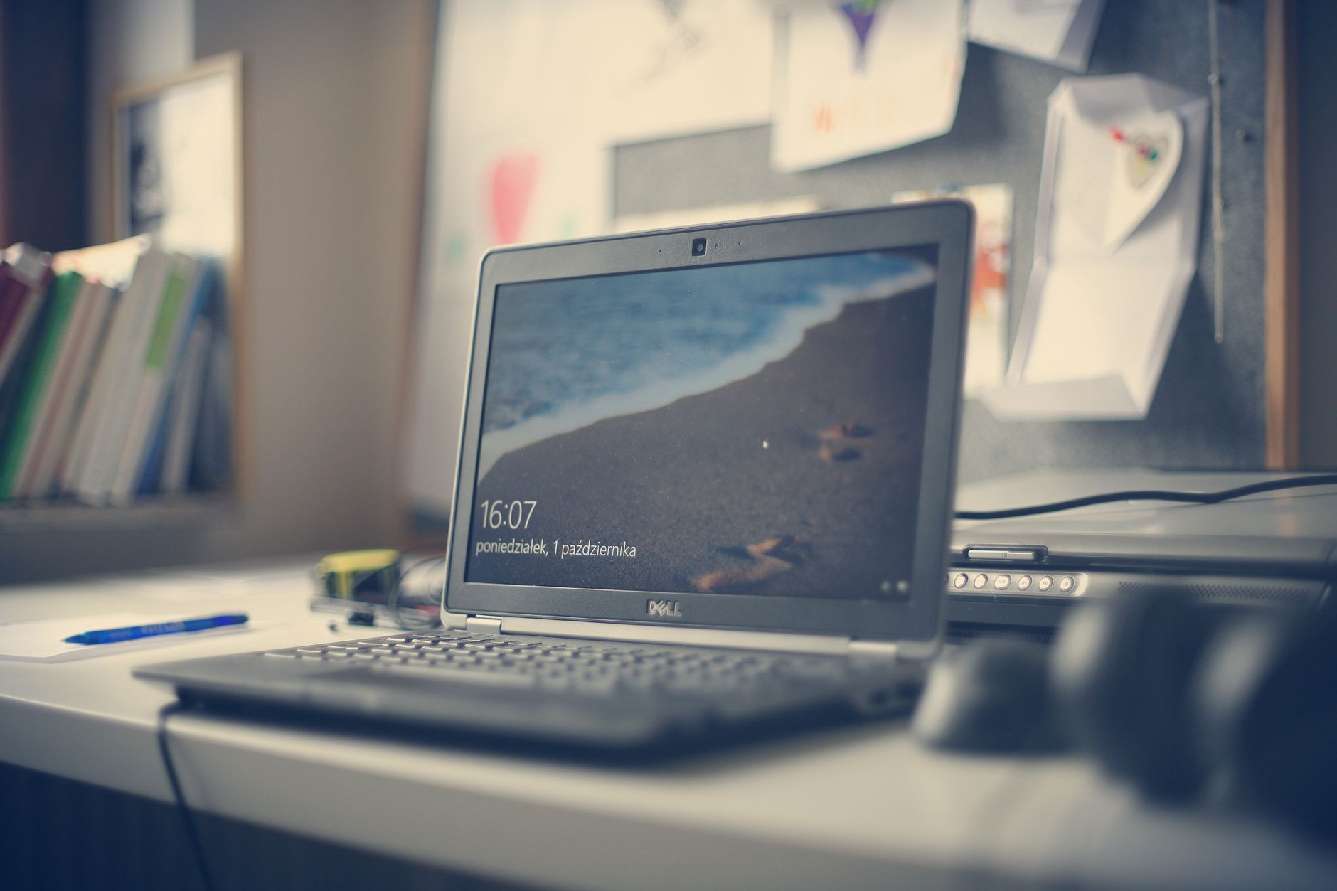 no internet on computer - A contemporary workspace featuring a Dell laptop, books, and stationery on a desk, reflecting modern office essentials.