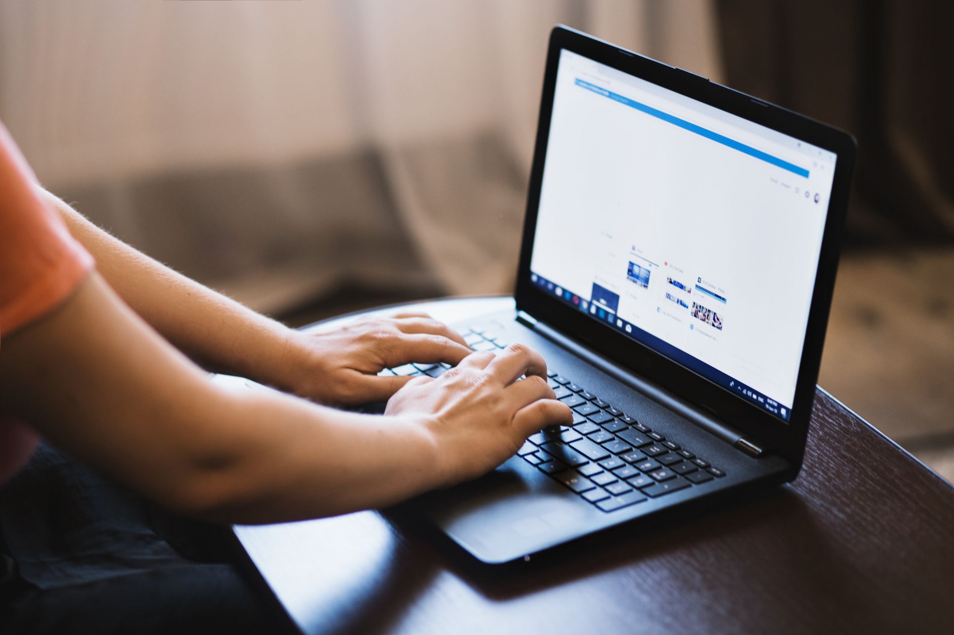 pc is connected but no internet - Close-up of person typing on a laptop indoors, showcasing technology use.