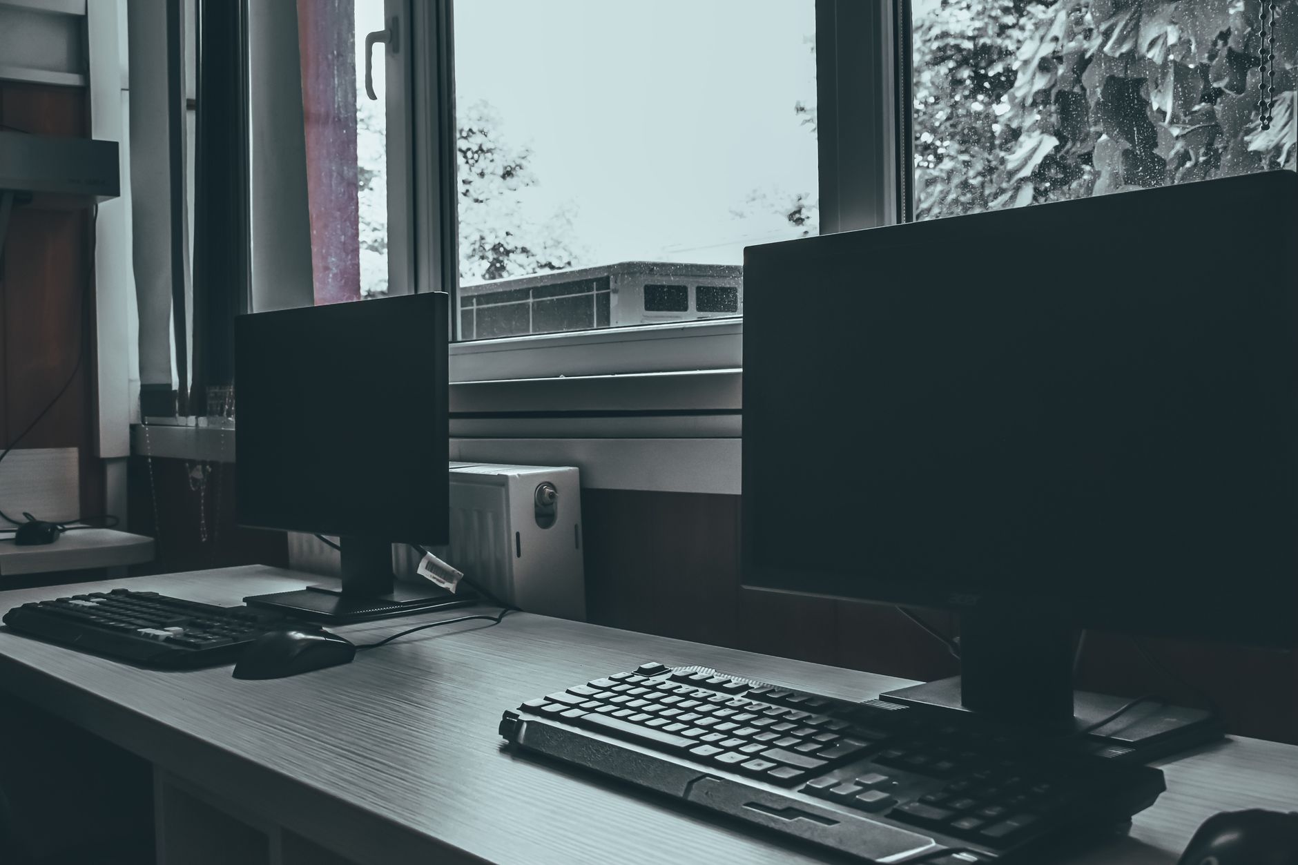 reset windows 10 network - Contemporary computers with black screens placed on desk near window in classroom or office