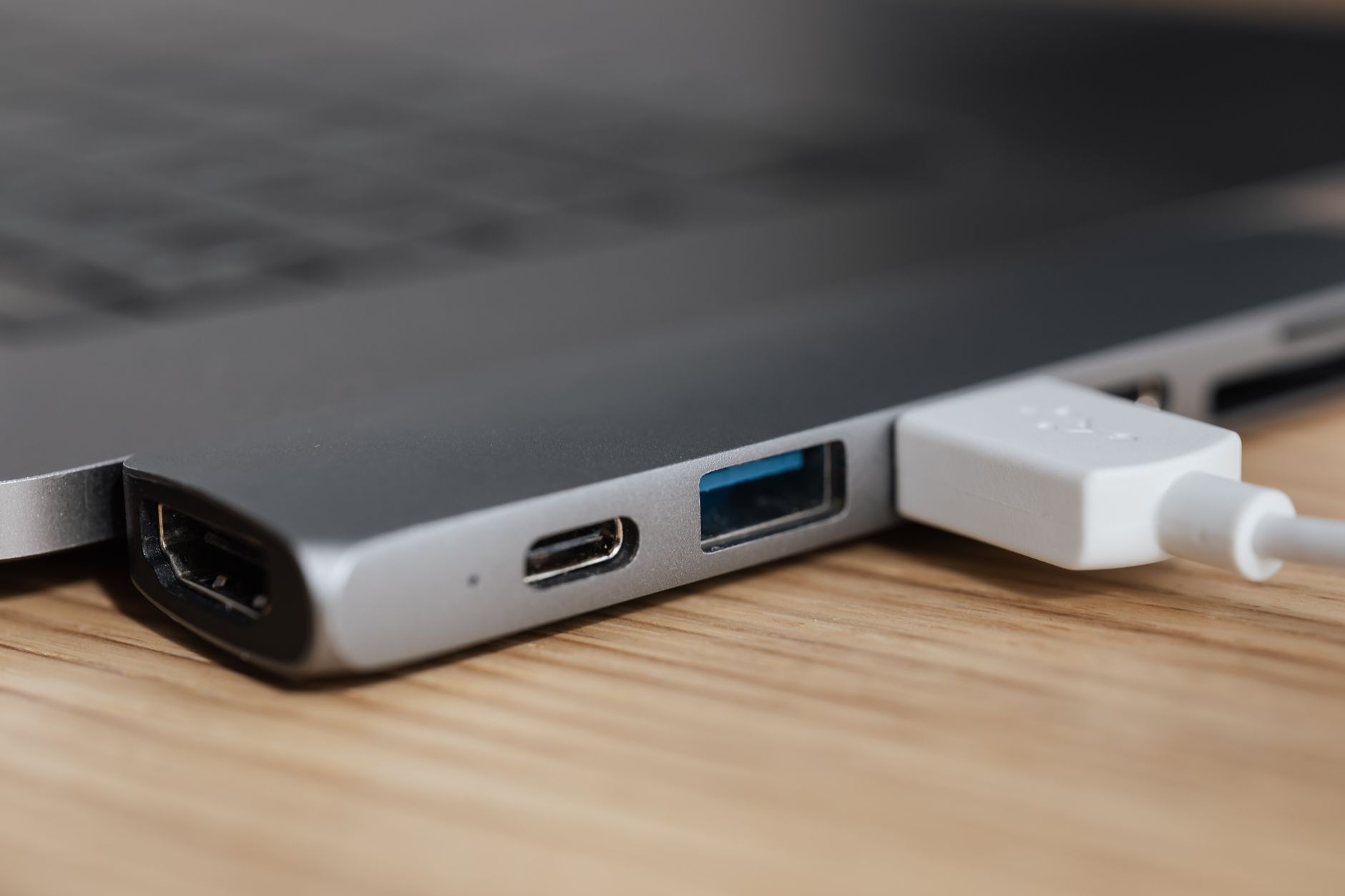 wifi usb adapter not working - USB type c multiport adapter with plugged white cable connected to modern laptop