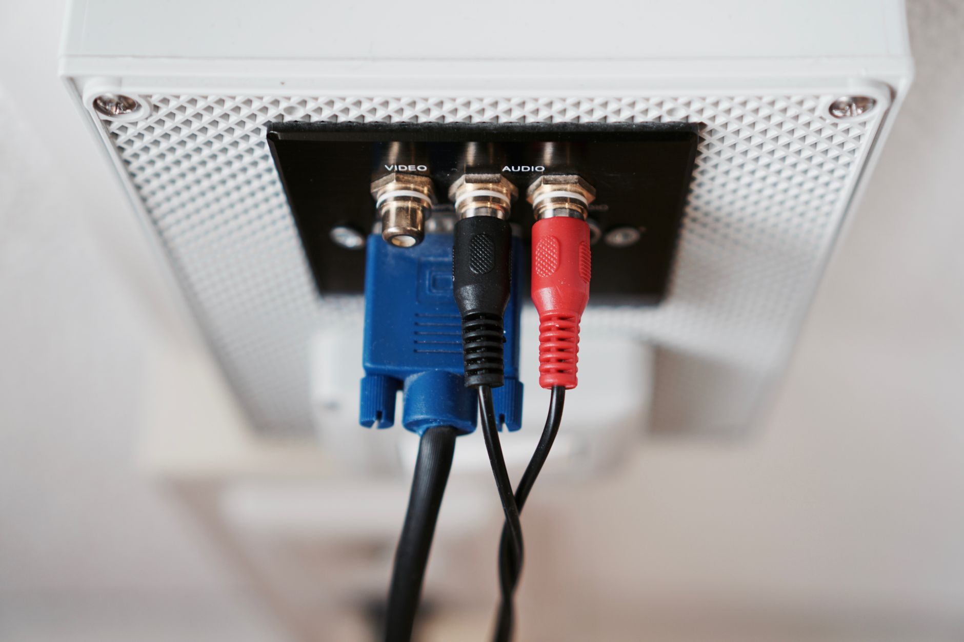 wifire won't connect - Detailed view of audio and video input cables connected to a wall socket.