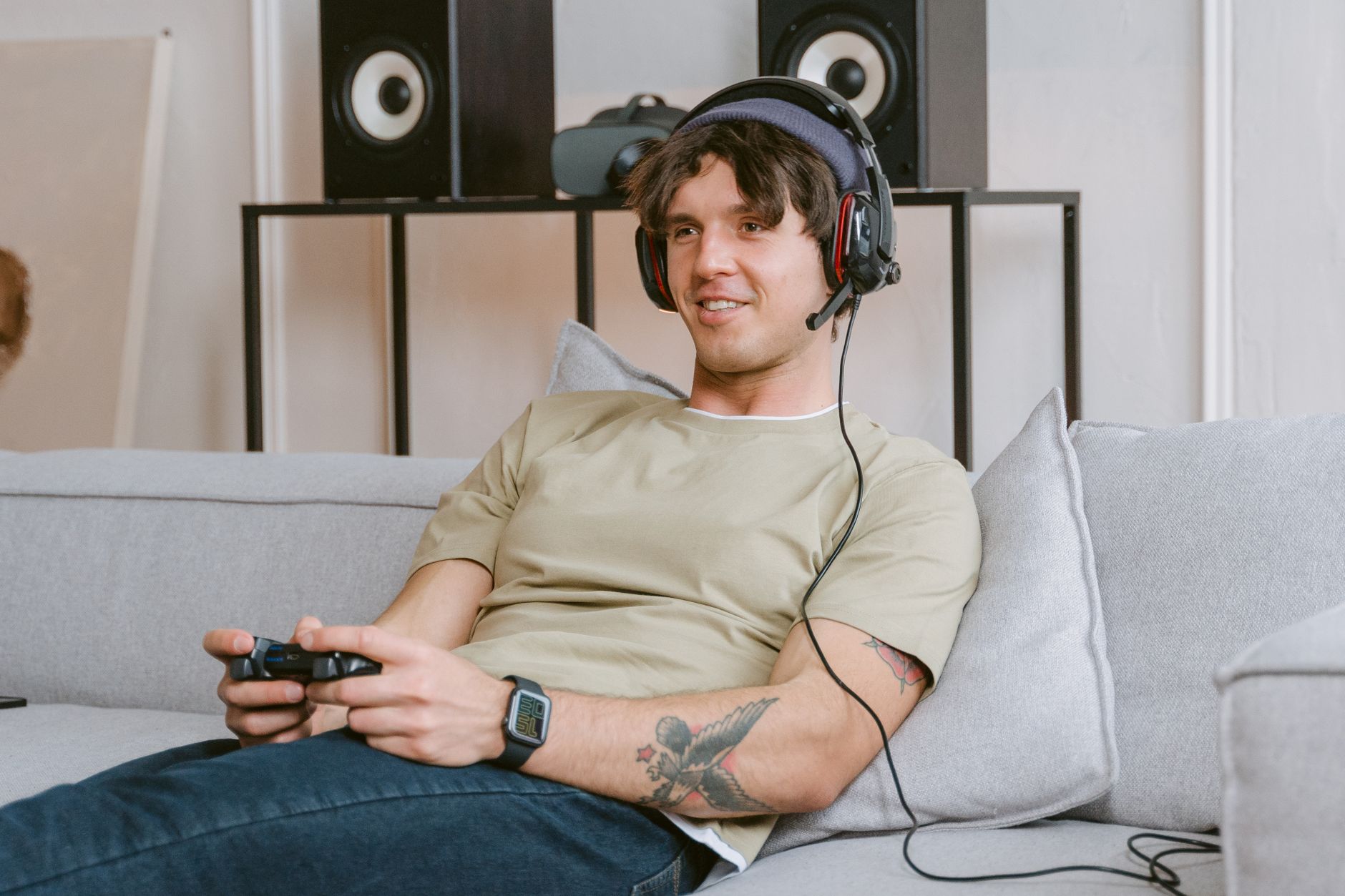 xbox won t connect to wifi but everything else does - Young man enjoying video gaming session at home with a headset and controller.